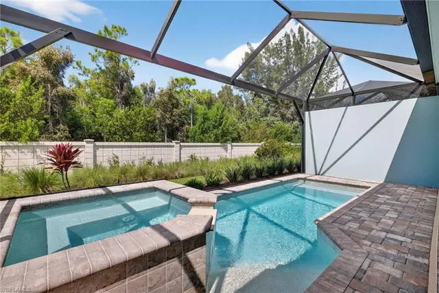 a view of a backyard with plants and a small yard