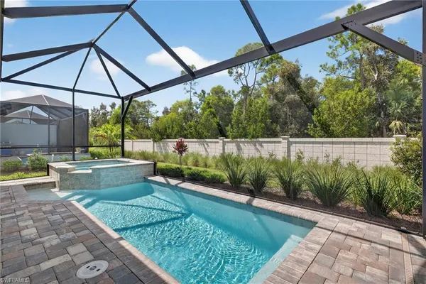 a view of a backyard with a swimming pool