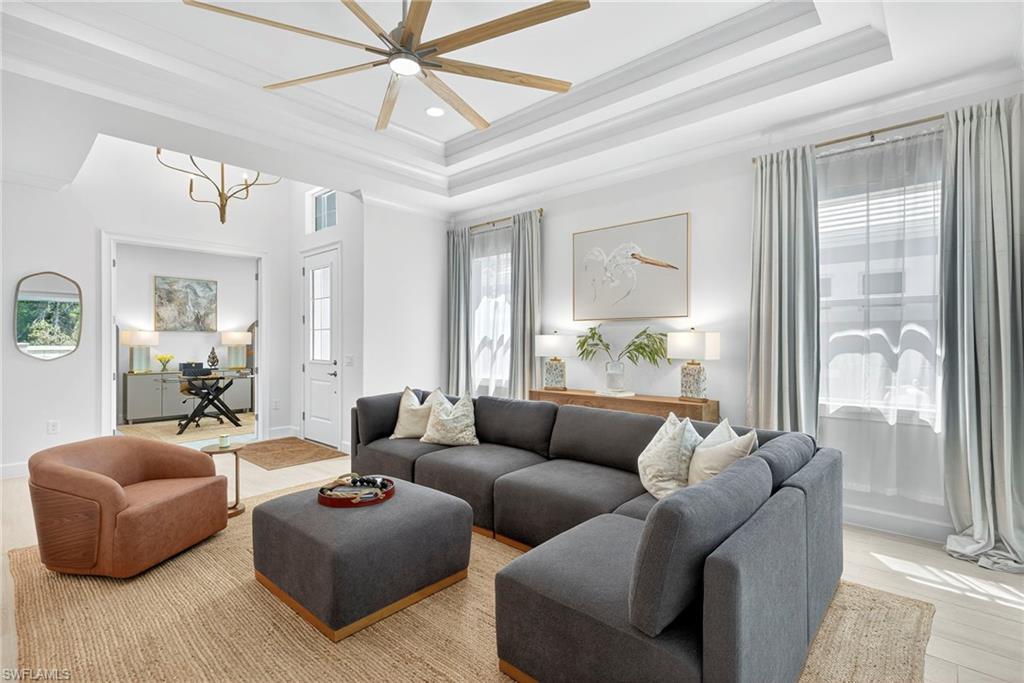 8877 Yucatan Court Naples, FL 34113 - Photo 4 of 29 a living room with furniture and a large window