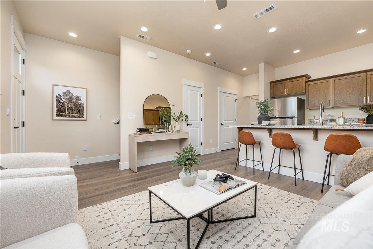 1457 North Bluffs Ridge Lane Boise, ID 83704 - Photo 4 of 20 Living room featuring recessed lighting, light wood-type flooring, and ceiling fan