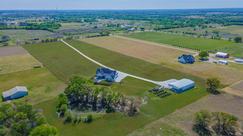 289 East Bell Road Waco, TX 76705 - Photo 37 of 40 Stocked tank, shop, metal planter beds, and green house