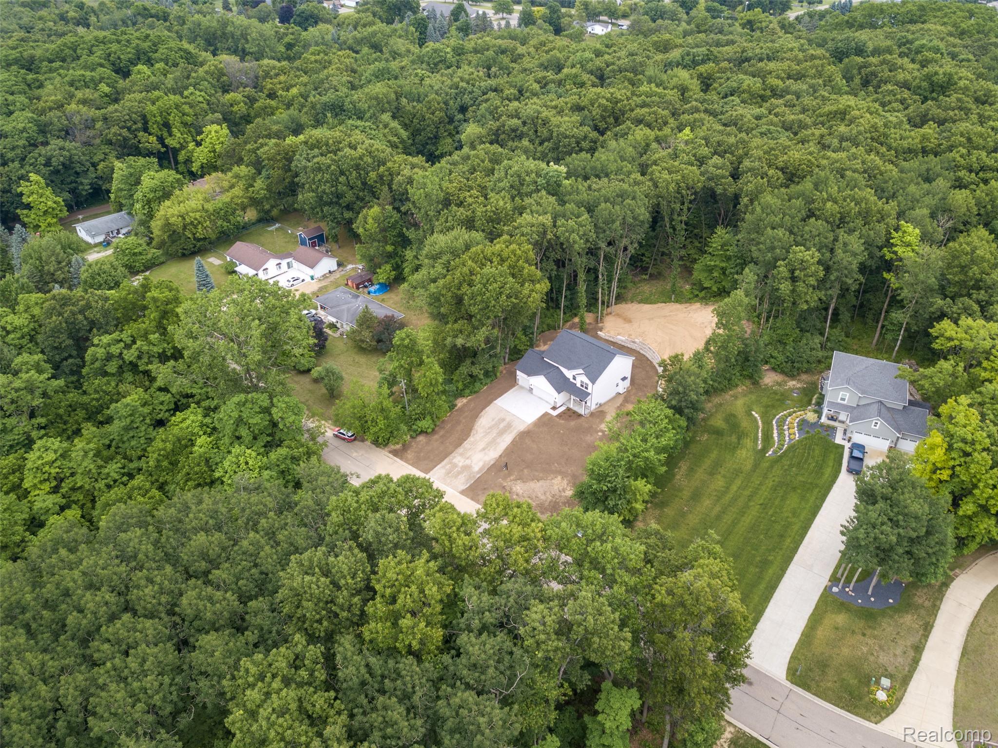 16085 Catalpa Ridge Holly, MI 48442 - Photo 39 of 40 Newly constructed residence featuring a light-colored exterior and a dark shingle roof