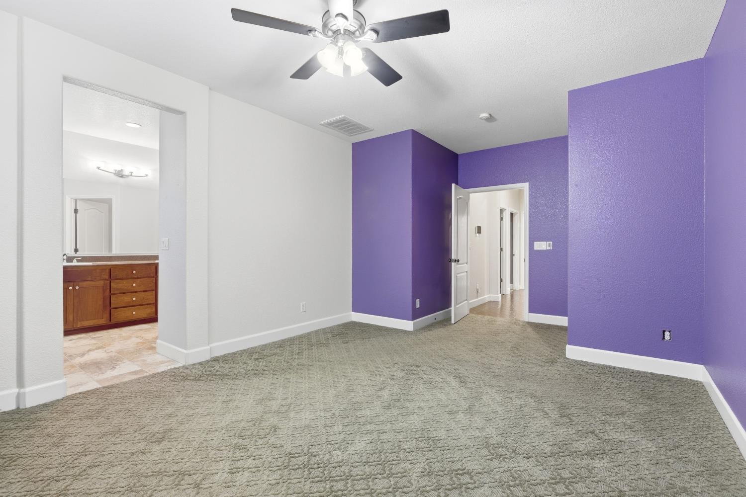 2609 Amir Drive Modesto, CA 95355 - Photo 24 of 36 a view of an empty room with a chandelier fan