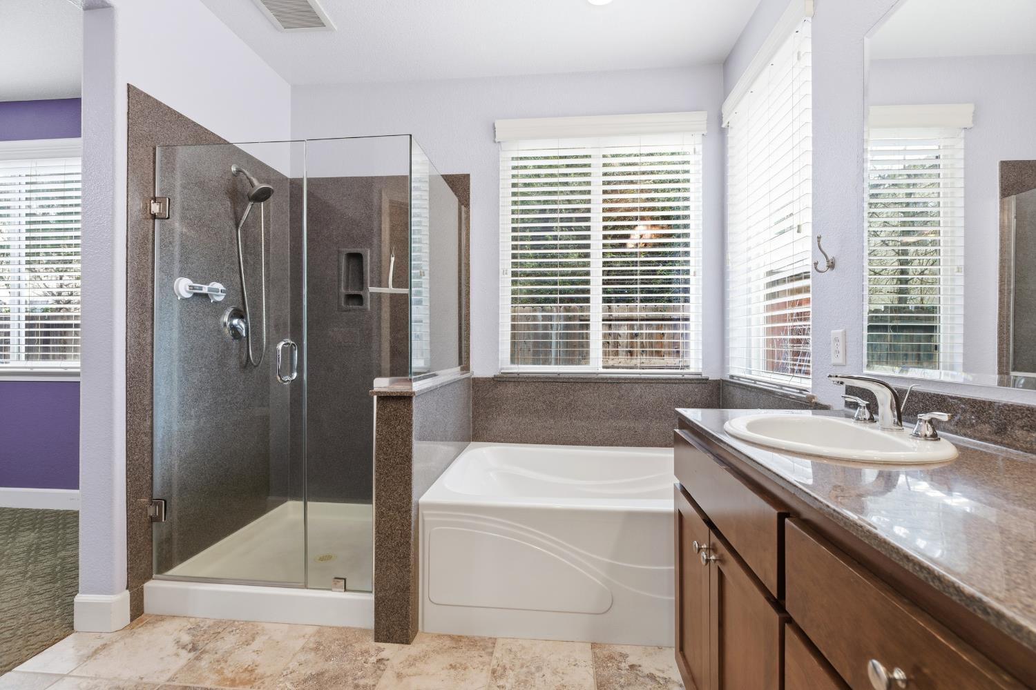 2609 Amir Drive Modesto, CA 95355 - Photo 25 of 36 a bathroom with a granite countertop tub sink and shower