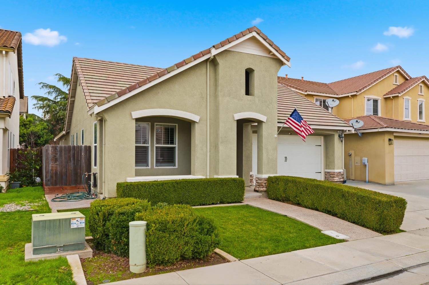 2609 Amir Drive Modesto, CA 95355 - Photo 3 of 36 a front view of a house with a yard