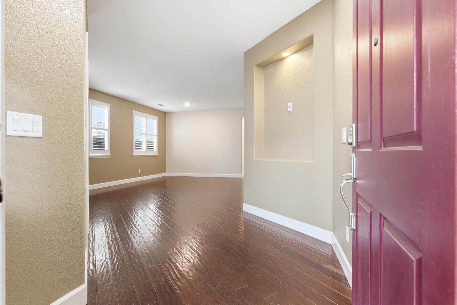 2609 Amir Drive Modesto, CA 95355 - Photo 6 of 36 a view of empty room with wooden floor and window