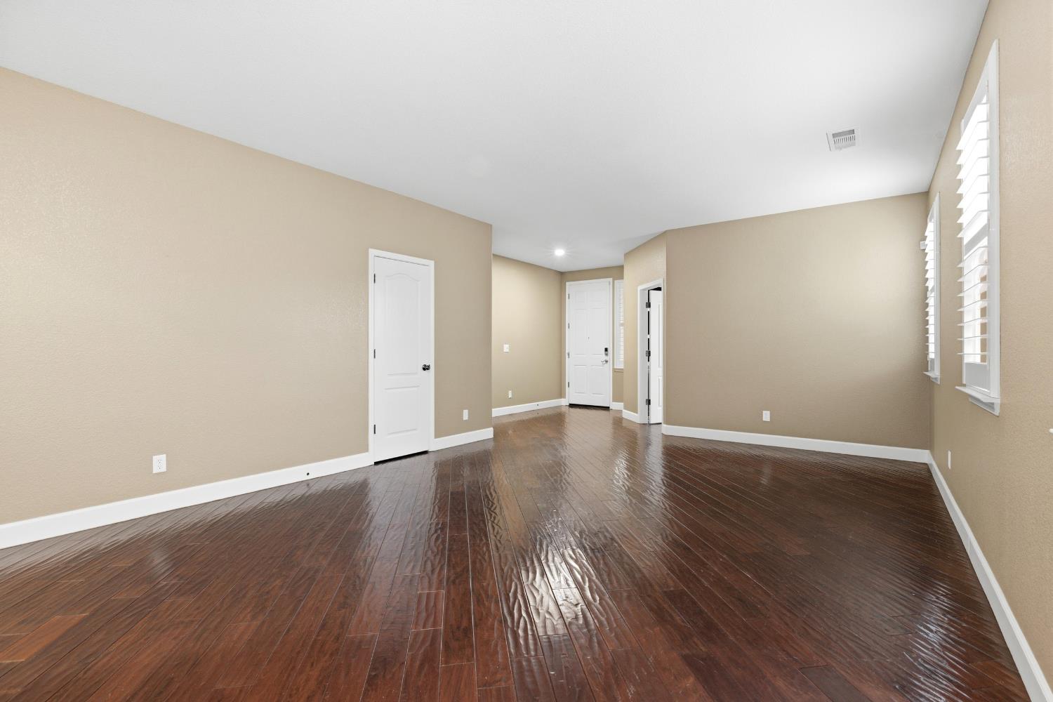 2609 Amir Drive Modesto, CA 95355 - Photo 8 of 36 a view of an empty room with wooden floor and a window