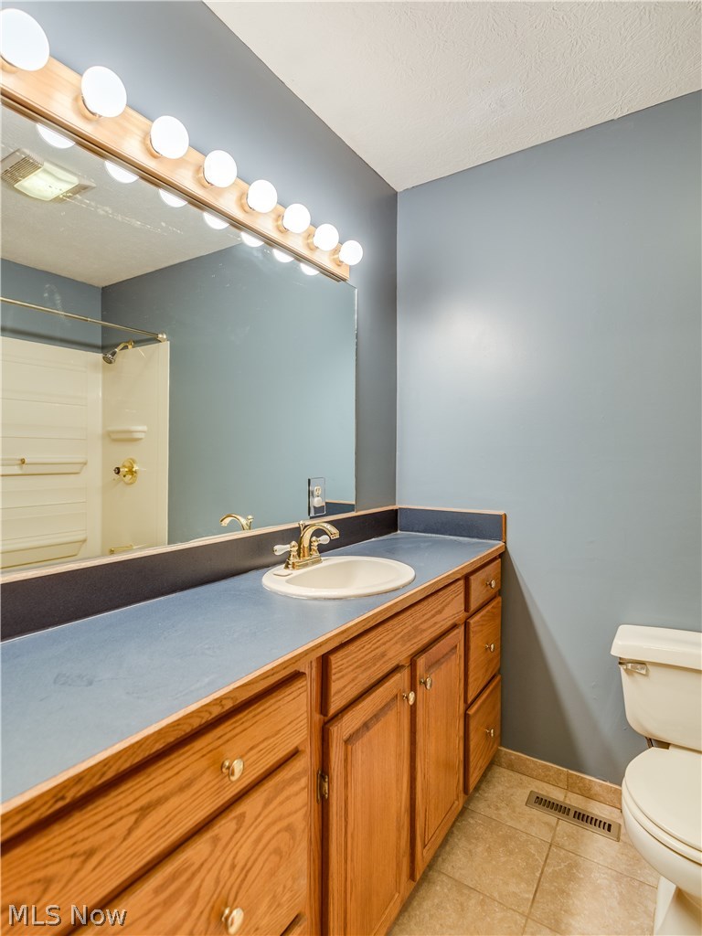 6644 Red Brush Road Ravenna, OH 44266 - Photo 21 of 35 Nicely lit master bathroom. The shower can be seen in the mirror.