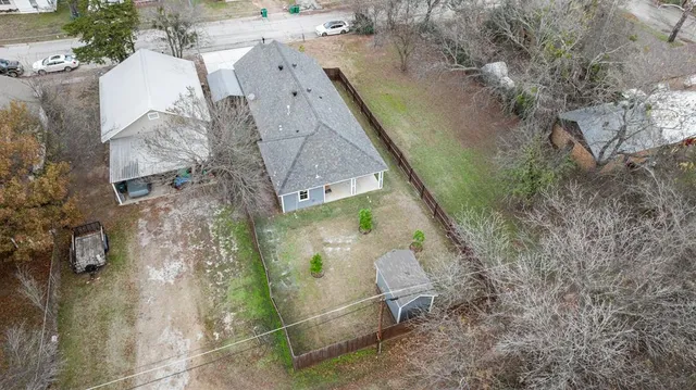 an aerial view of a house with outdoor space