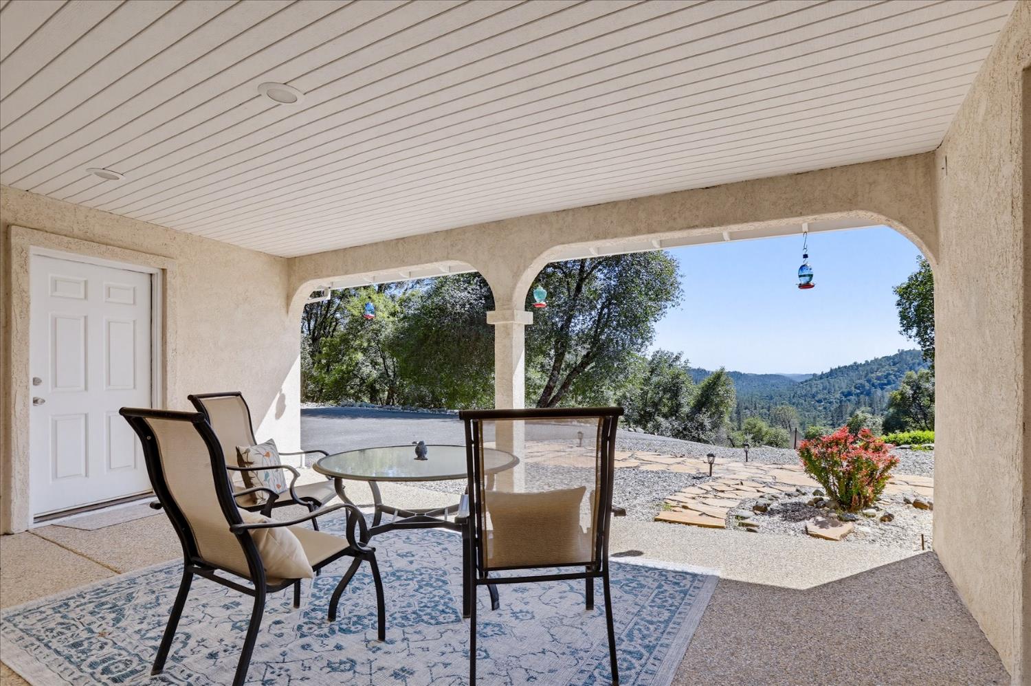 18639 Fay Ridge Court Grass Valley, CA 95949 - Photo 91 of 99 a view of a patio with table and chairs with wooden floor and plants