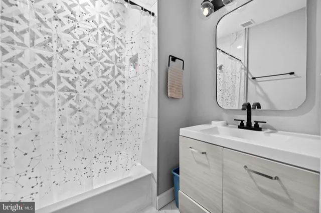 a bathroom with a sink a vanity and a mirror