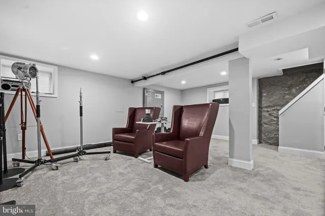 a view of a livingroom with furniture and windows