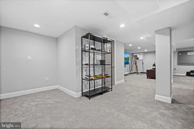 an empty room with windows and entryway