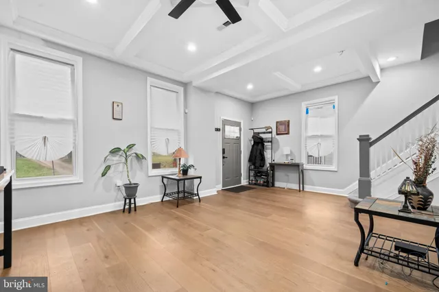a view of a livingroom with furniture and a window