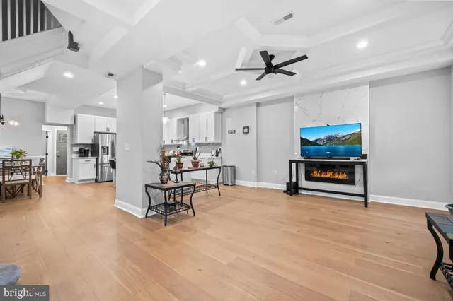 a view of a livingroom with furniture and a flat screen tv