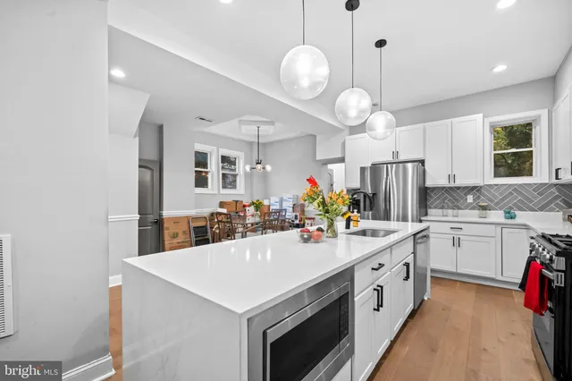 a kitchen with a sink and a stove