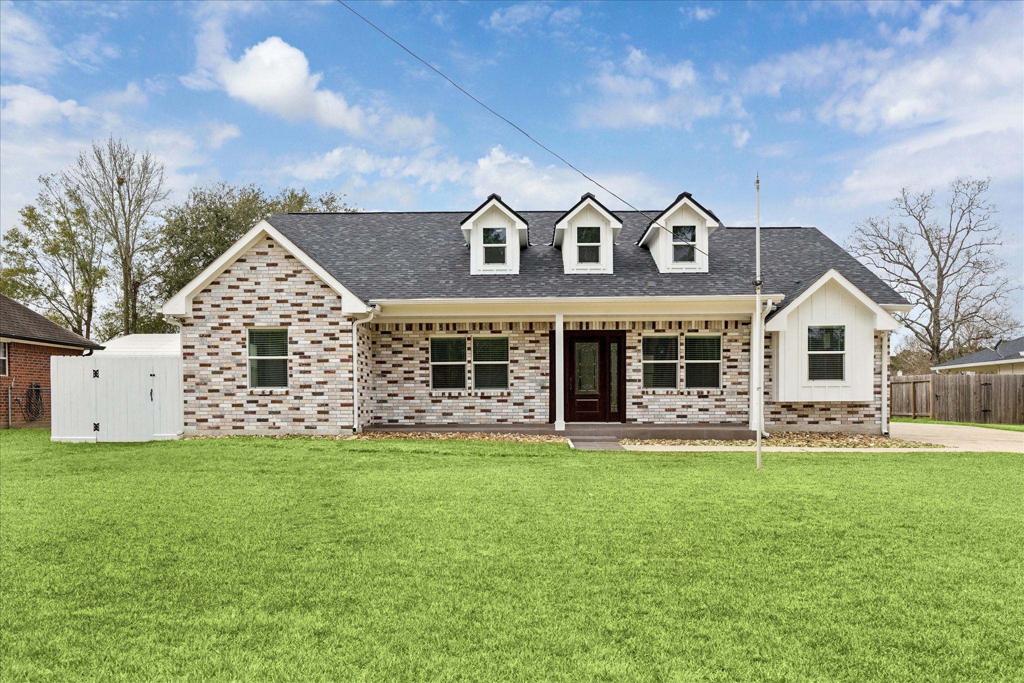 30731 Martens Road Tomball, TX 77375 - Photo 1 of 25 a front view of a house with a yard and garage