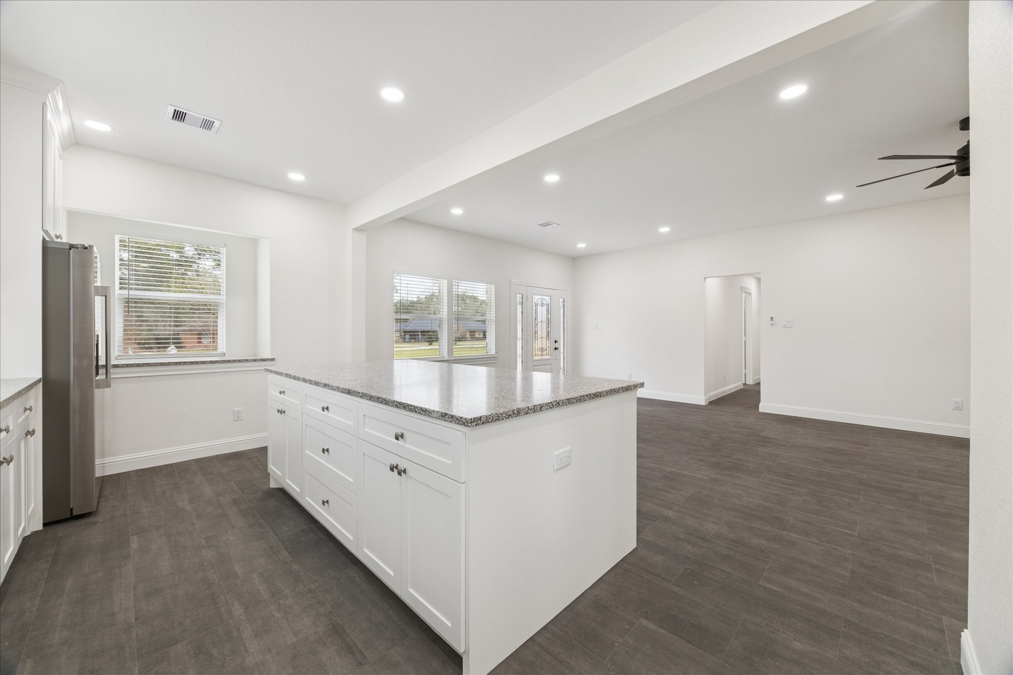 30731 Martens Road Tomball, TX 77375 - Photo 12 of 25 a kitchen with counter top space and windows