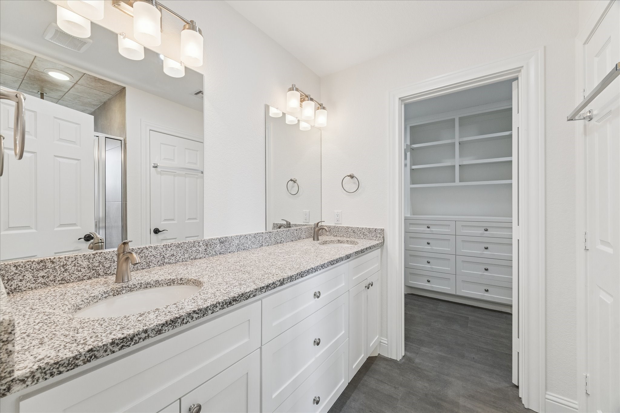 30731 Martens Road Tomball, TX 77375 - Photo 15 of 25 a bathroom with a granite countertop double vanity sink mirror and