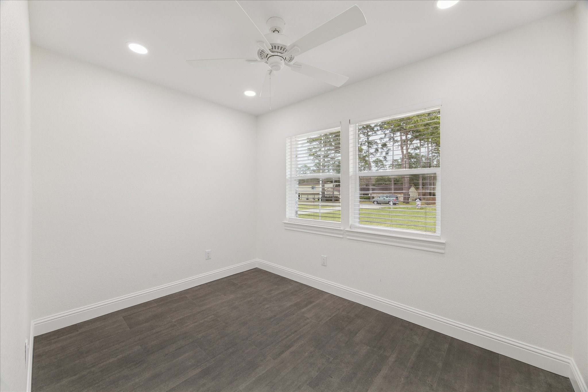 30731 Martens Road Tomball, TX 77375 - Photo 17 of 25 an empty room with wooden floor and windows