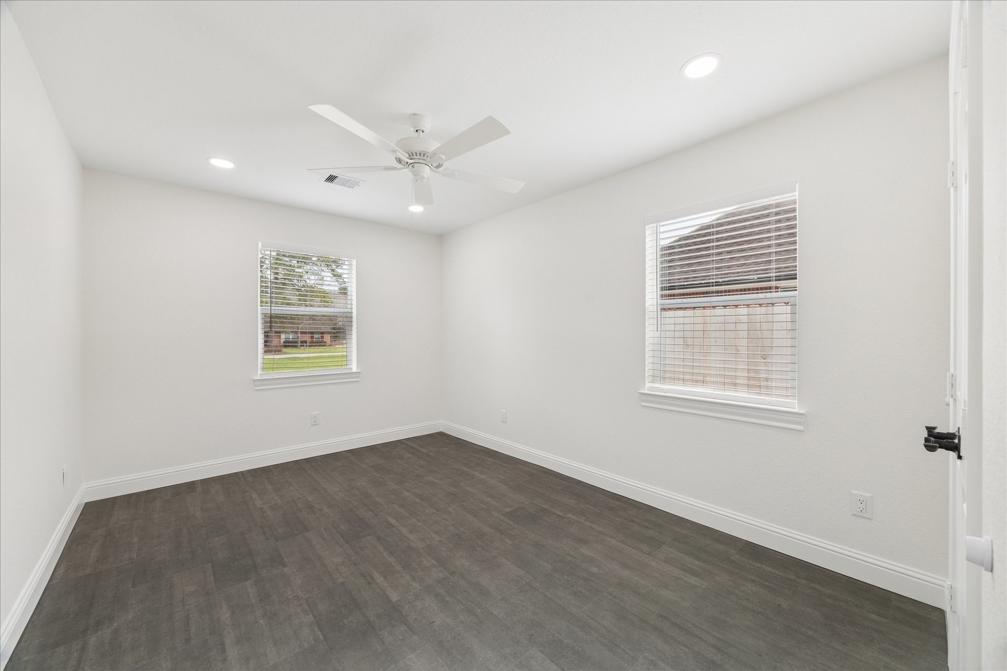 30731 Martens Road Tomball, TX 77375 - Photo 18 of 25 an empty room with a window and ceiling fan
