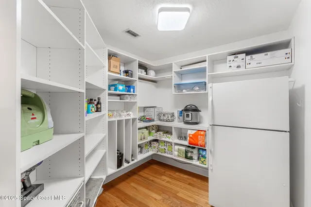 a hallway with storage and utility