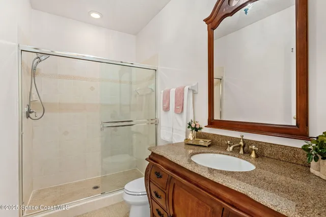 a view of a porch with furniture and floor to ceiling window