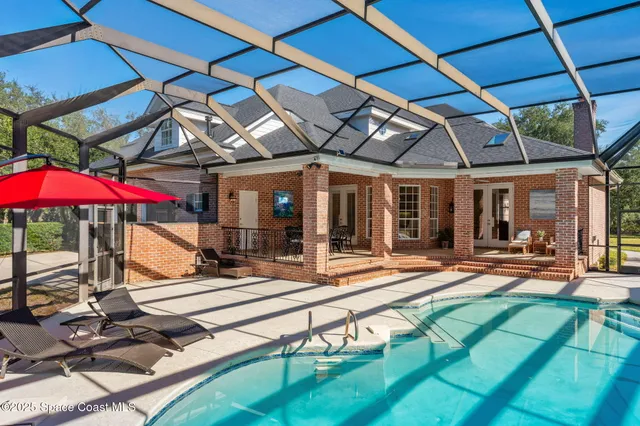 a view of a dining room with furniture wooden floor and a potted plant