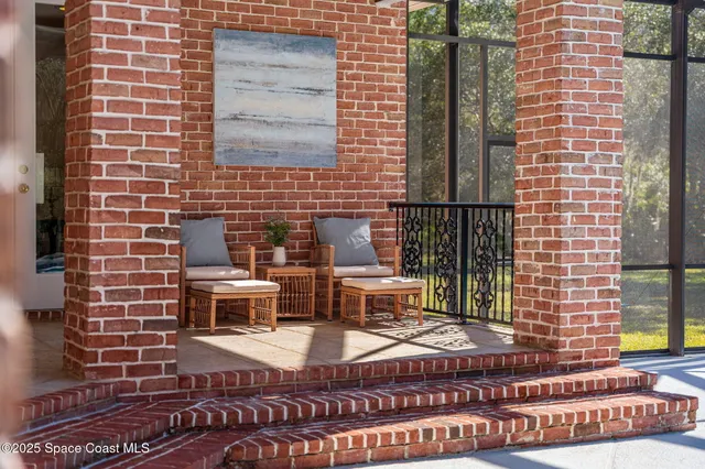 a aerial view of a house with a yard