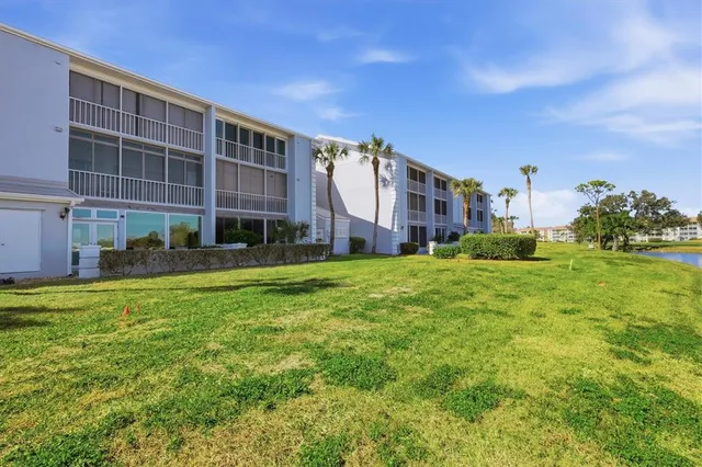 a view of a lake with houses in the back