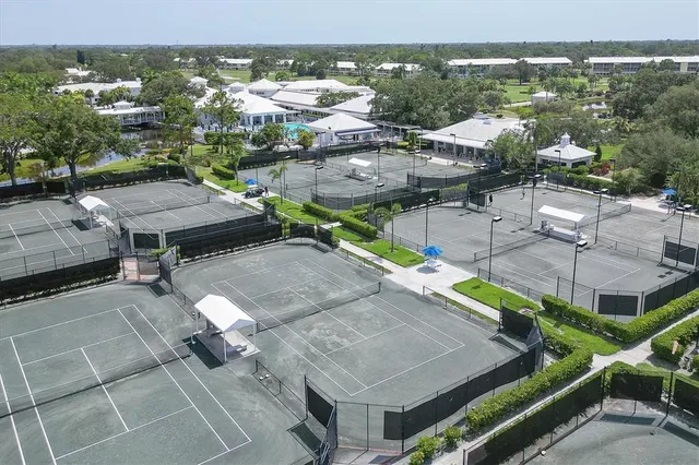 an aerial view of residential houses with city view