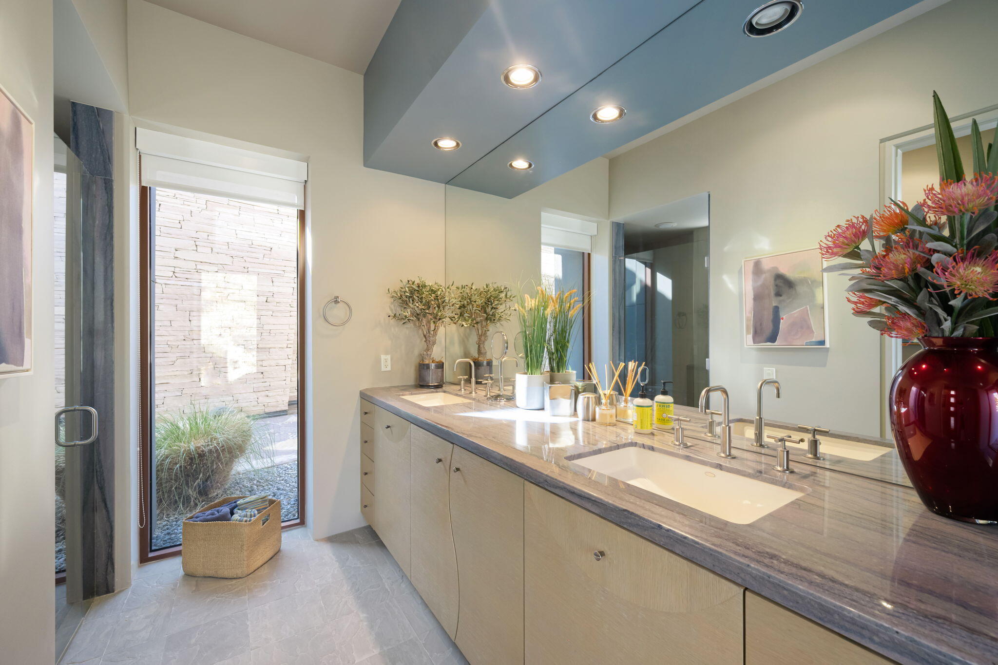 45 Sky Ridge Road Rancho Mirage, CA 92270 - Photo 24 of 85 a bathroom with a granite countertop sink a large mirror and a shower