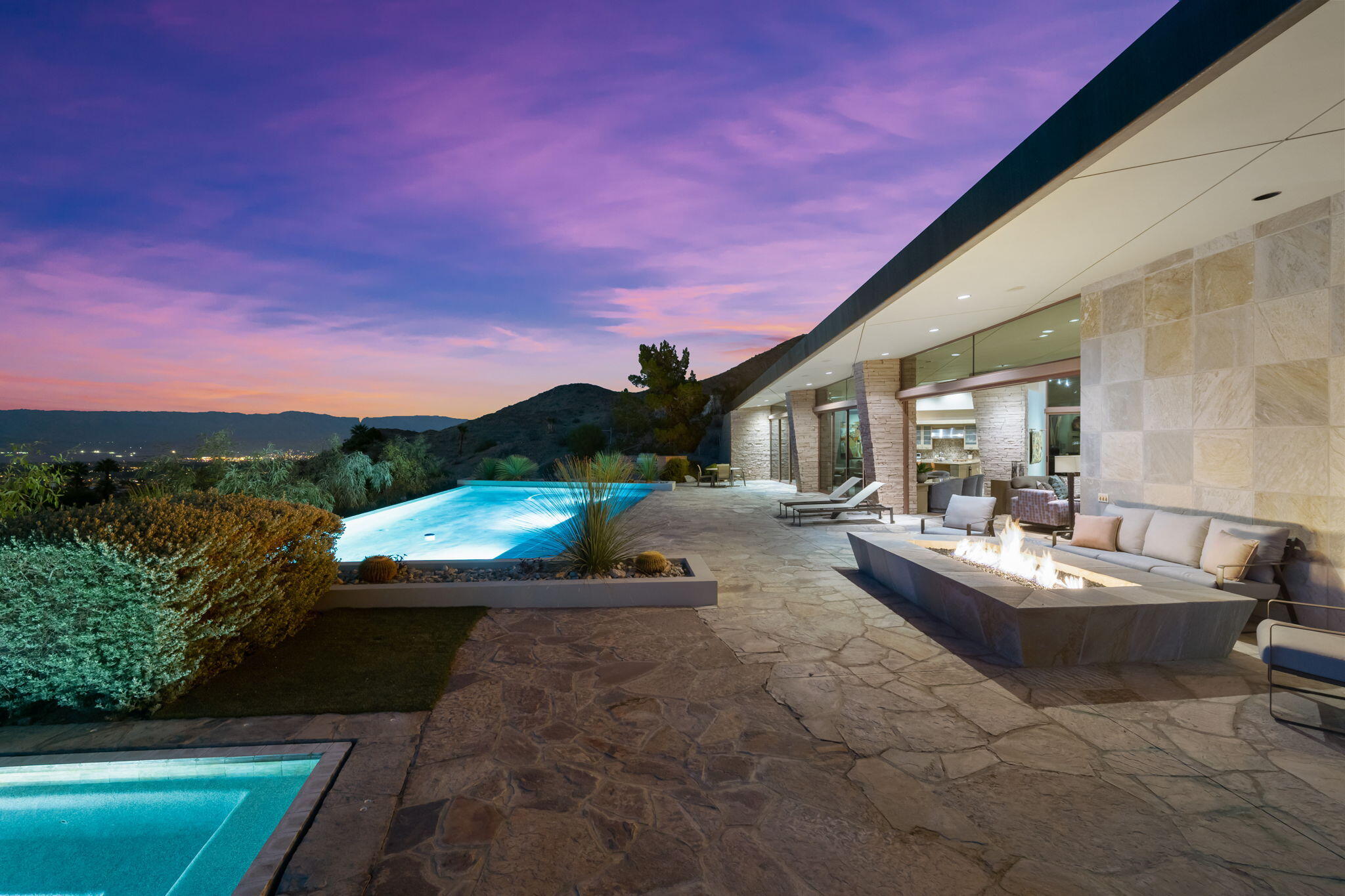45 Sky Ridge Road Rancho Mirage, CA 92270 - Photo 41 of 85 a view of a patio with couches and table and chairs with wooden floor and fence