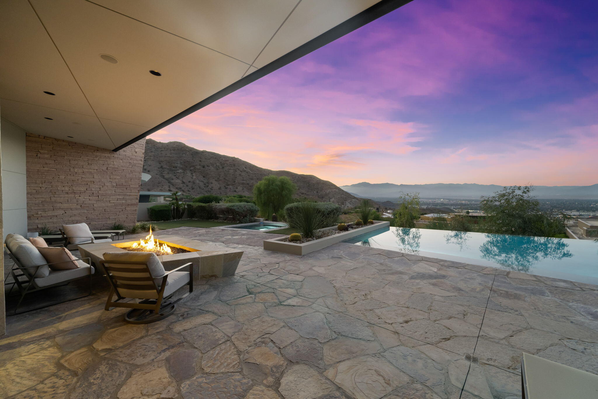 45 Sky Ridge Road Rancho Mirage, CA 92270 - Photo 44 of 85 a backyard of a house with table and chairs