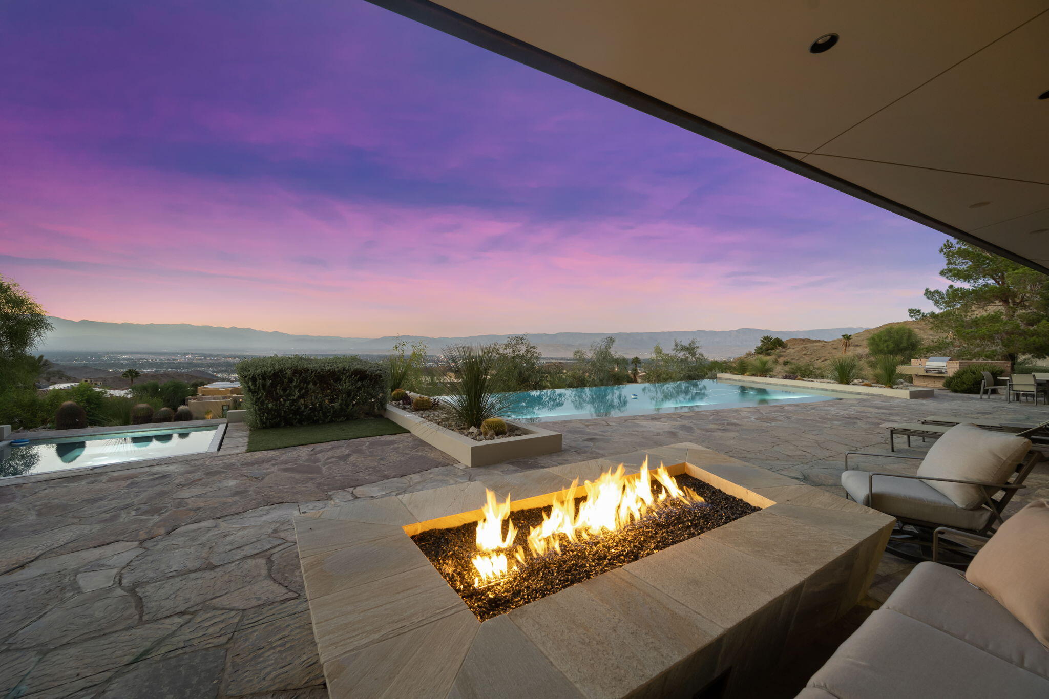 45 Sky Ridge Road Rancho Mirage, CA 92270 - Photo 46 of 85 a view of swimming pool with a table and chairs
