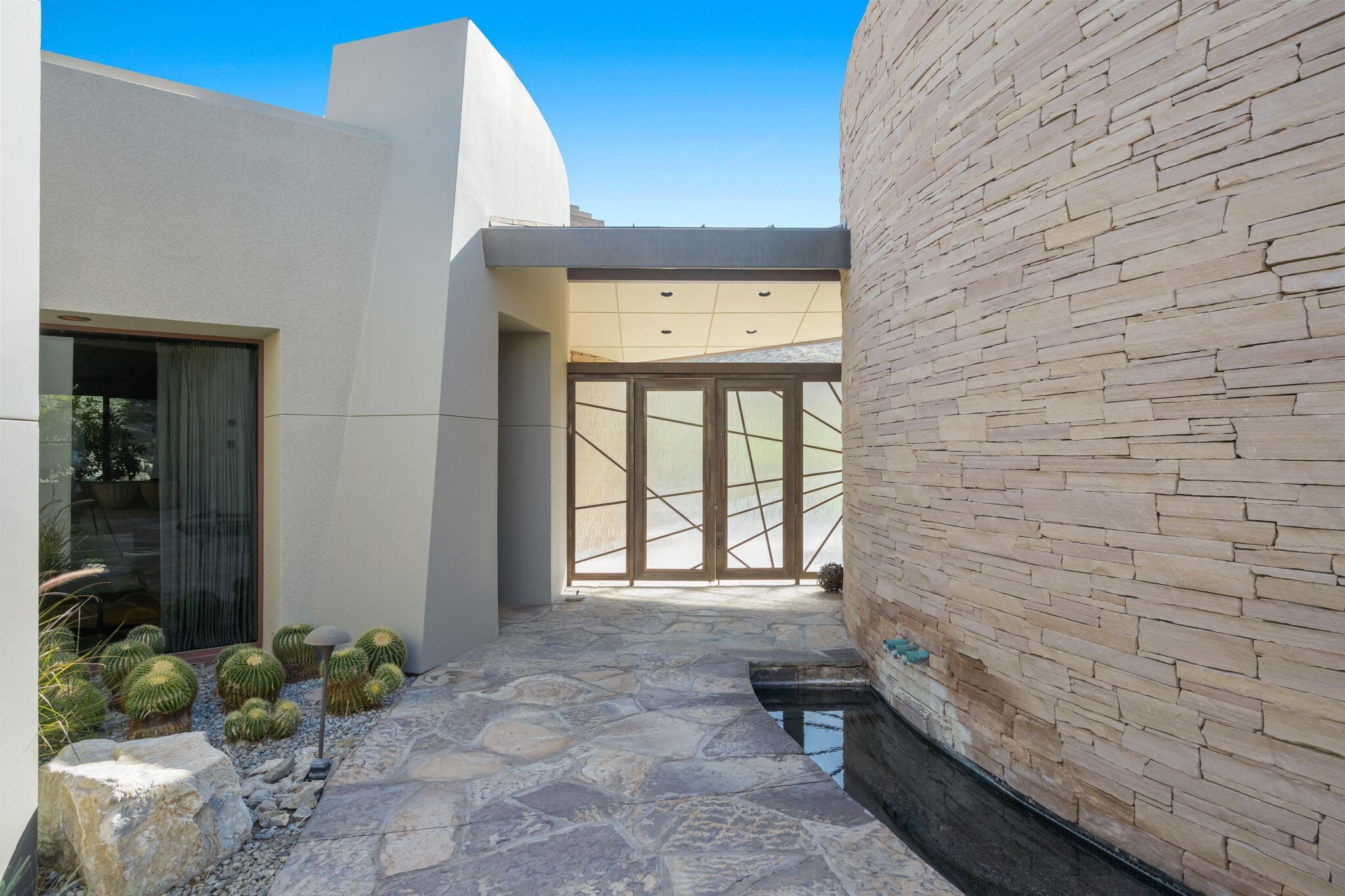 45 Sky Ridge Road Rancho Mirage, CA 92270 - Photo 67 of 85 a bathroom with a toilet and a large window