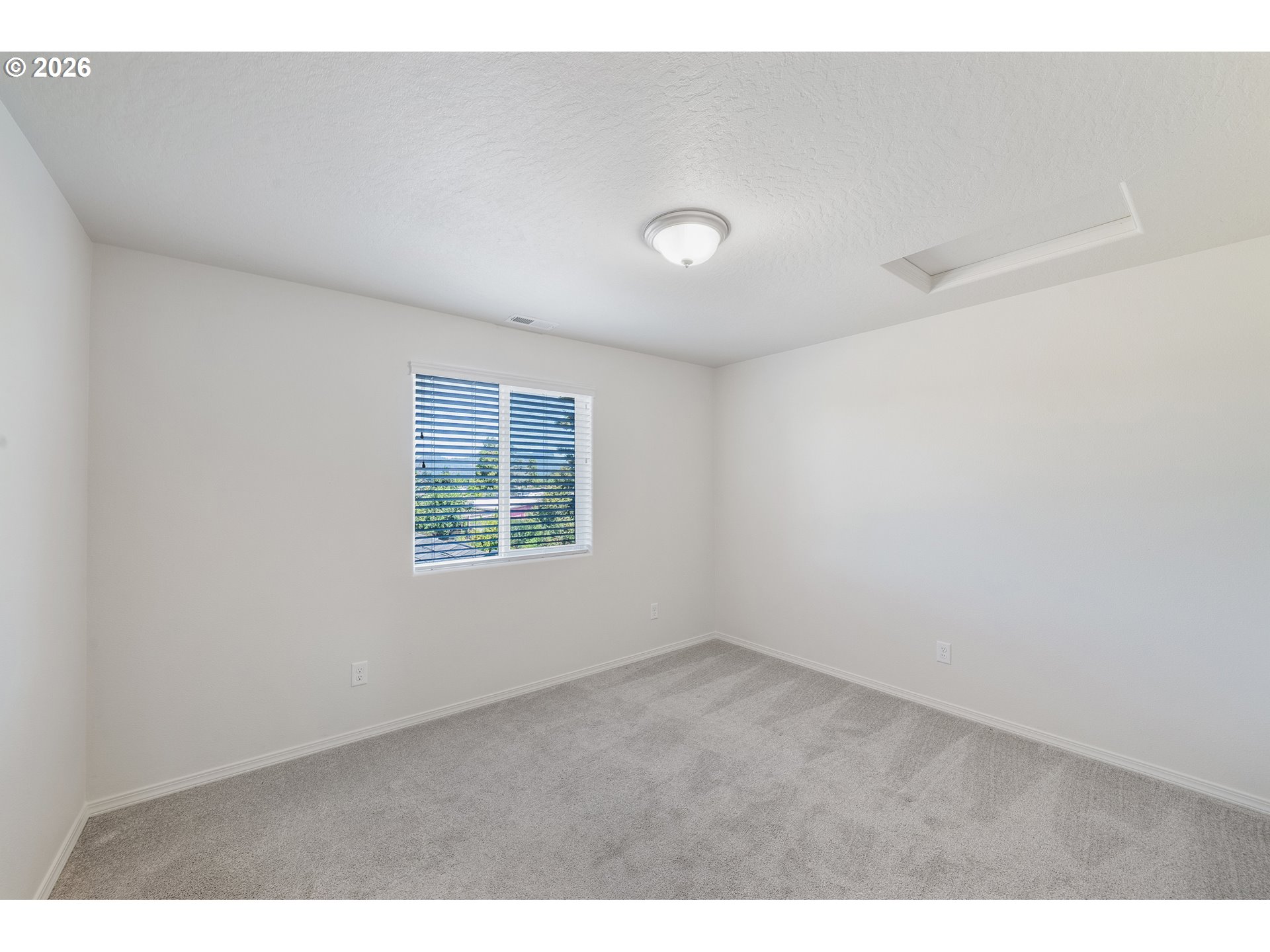5290 Squirrel Street Springfield, OR 97478 - Photo 19 of 41 a view of an empty room with a window
