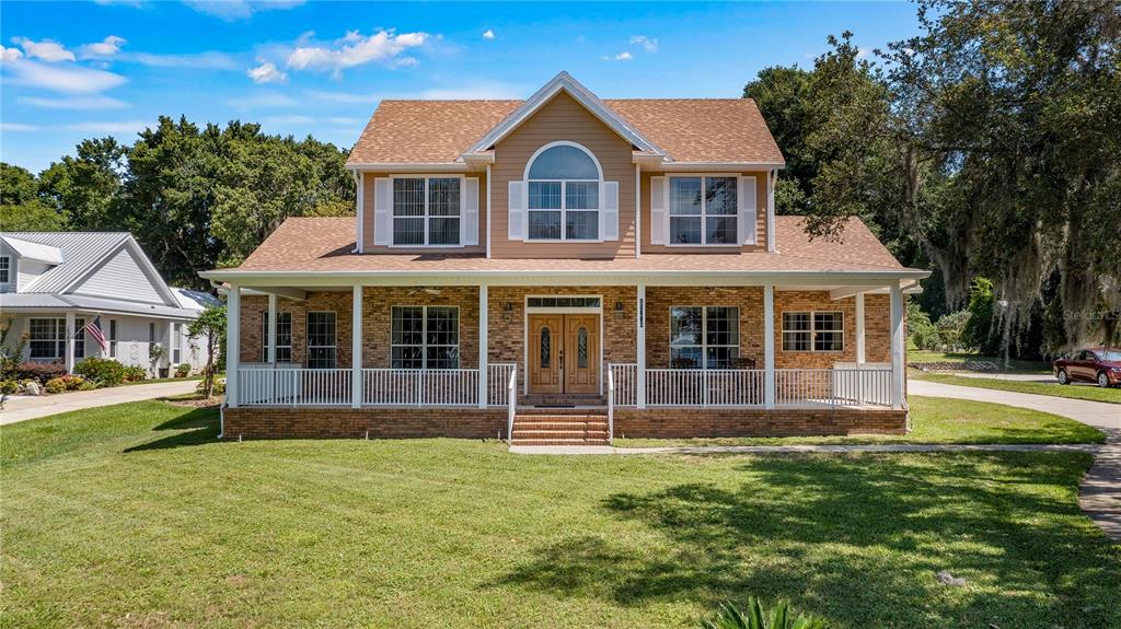 10336 Lake Louisa Road Clermont, FL 34711 - Photo 2 of 62 a front view of a house with a garden