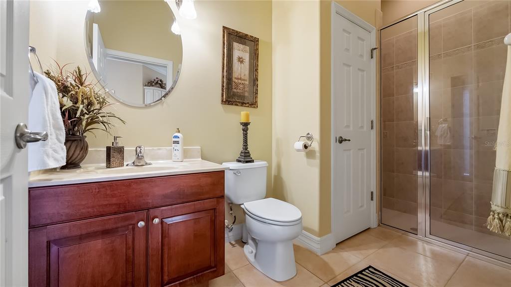 10336 Lake Louisa Road Clermont, FL 34711 - Photo 22 of 62 a bathroom with a toilet a sink and shower