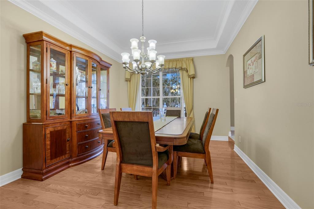 10336 Lake Louisa Road Clermont, FL 34711 - Photo 22 of 58 a view of a dining room with furniture window and wooden floor