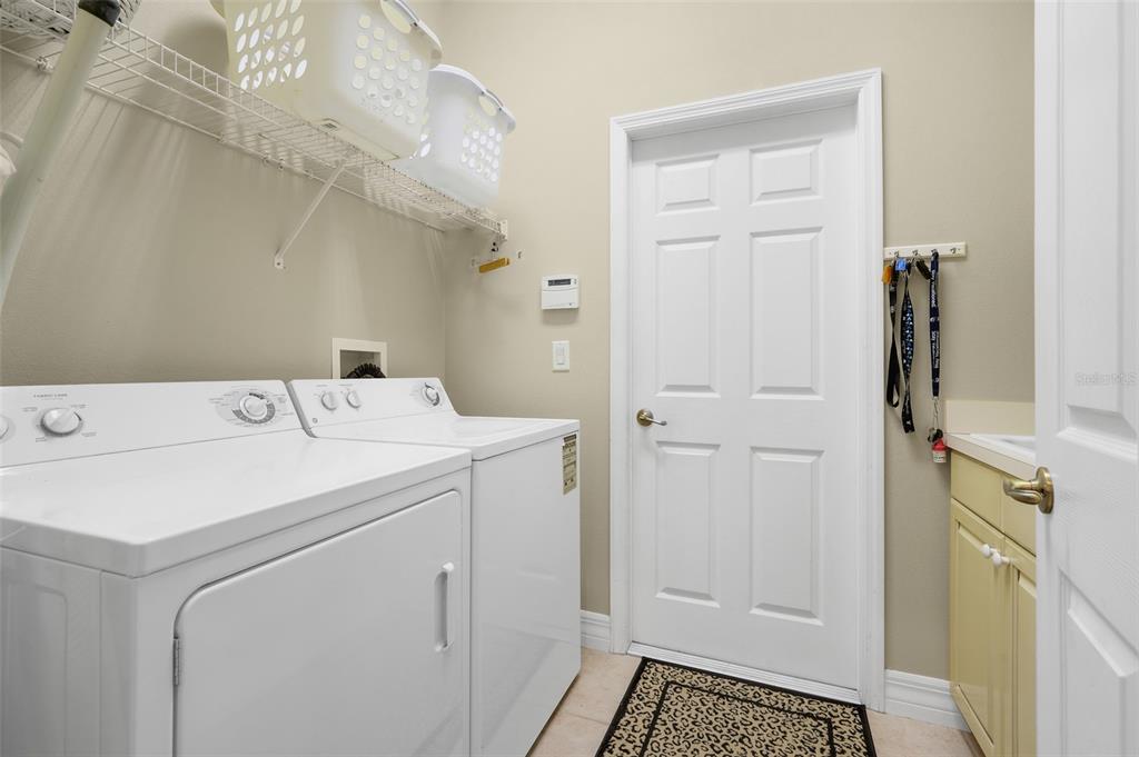 10336 Lake Louisa Road Clermont, FL 34711 - Photo 30 of 58 a utility room with dryer and washer