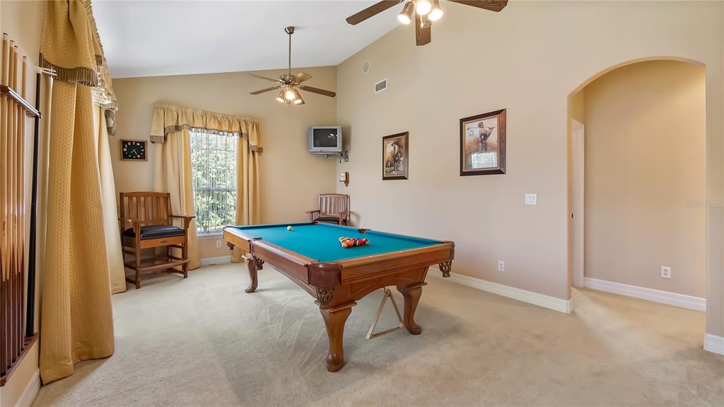 10336 Lake Louisa Road Clermont, FL 34711 - Photo 32 of 62 a room with pool table and windows