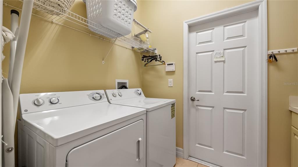 10336 Lake Louisa Road Clermont, FL 34711 - Photo 37 of 62 a utility room with dryer and washer