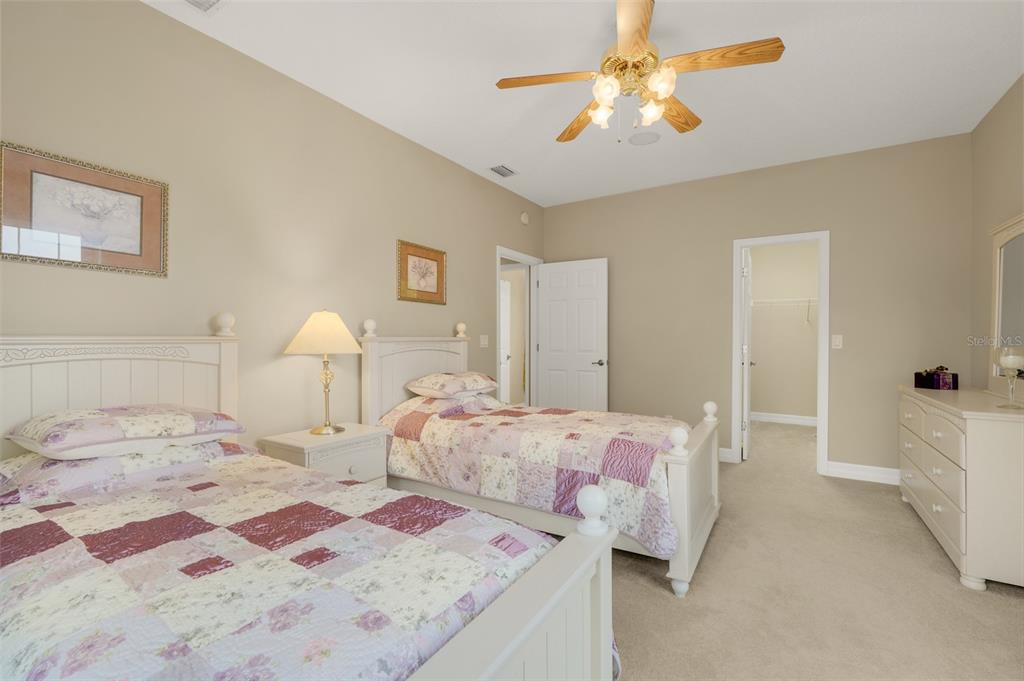 10336 Lake Louisa Road Clermont, FL 34711 - Photo 37 of 58 a bedroom with a bed and a lamp