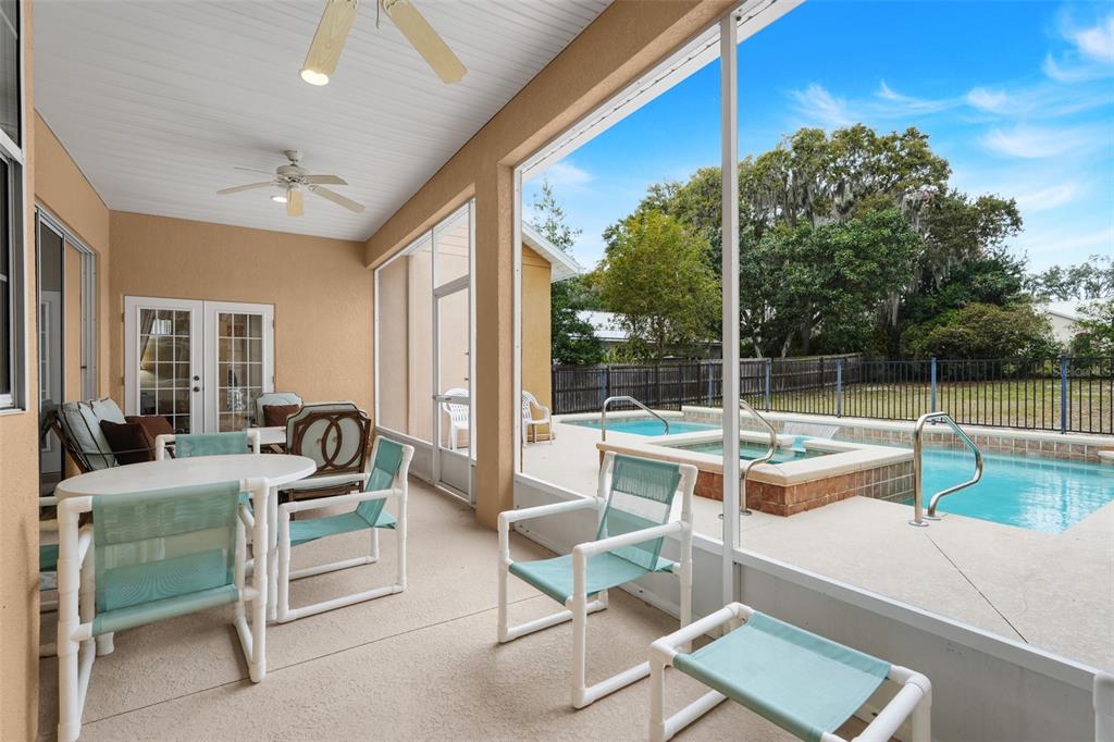 10336 Lake Louisa Road Clermont, FL 34711 - Photo 40 of 58 a view of a patio with couches table and chairs