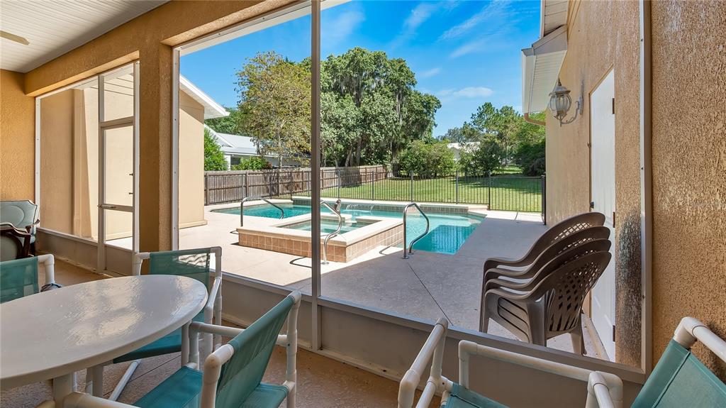 10336 Lake Louisa Road Clermont, FL 34711 - Photo 40 of 62 a view of a balcony with a table and chairs