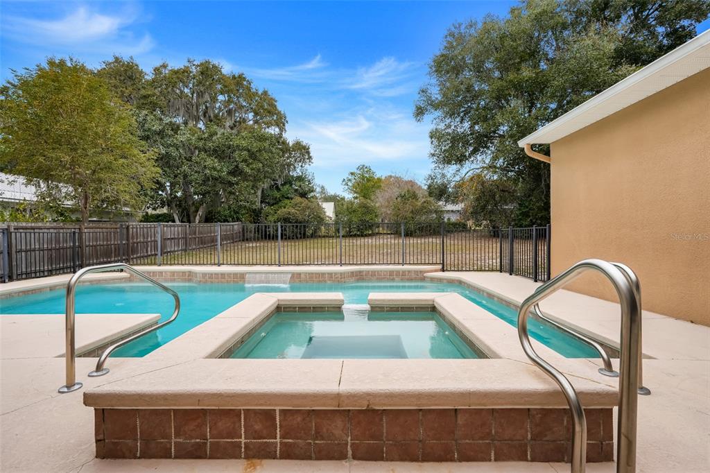 10336 Lake Louisa Road Clermont, FL 34711 - Photo 42 of 58 a view of a backyard with swimming pool