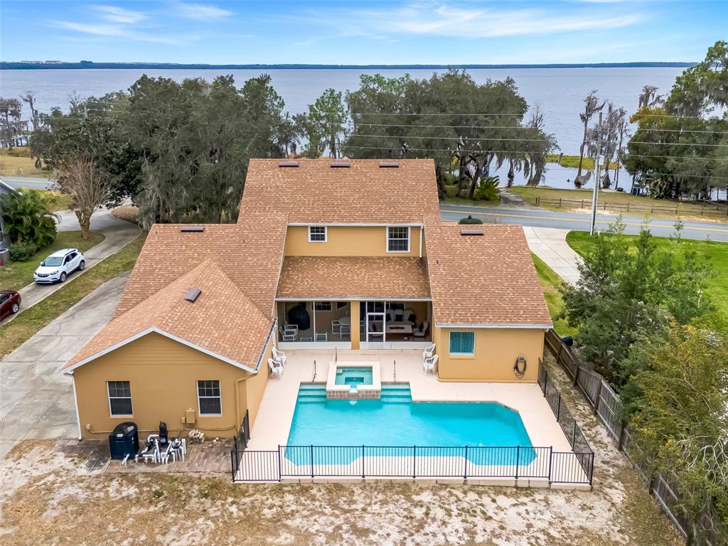 10336 Lake Louisa Road Clermont, FL 34711 - Photo 47 of 58 aerial view of a house with garden