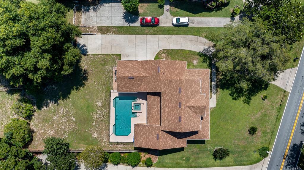 10336 Lake Louisa Road Clermont, FL 34711 - Photo 48 of 62 an aerial view of house with yard swimming pool and outdoor seating