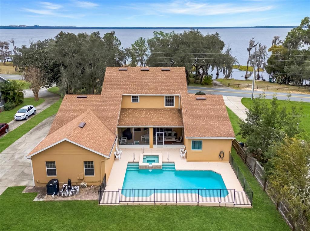 10336 Lake Louisa Road Clermont, FL 34711 - Photo 58 of 58 an aerial view of a house with garden